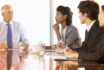 A group of consultants sitting around a boardroom table at Express Scripts Canada 