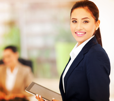 A young female Express Scripts Canada professional holding a laptop during a  thought leadership seminar