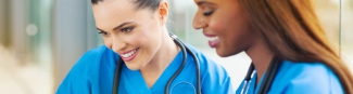 Two nurses talking and smiling